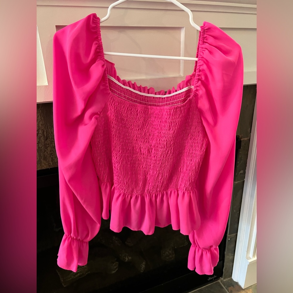 Pink long sleeve square neck blouse.